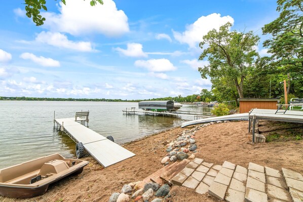 A nice beach area with a deck, pedal boat, dock, canoe all available to use 