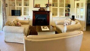 Relax and Unwind: Cozy Lounge with Fireplace
