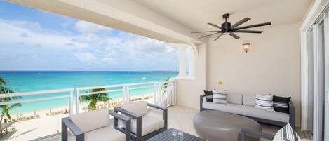 Furnished balcony with oceanfront views.