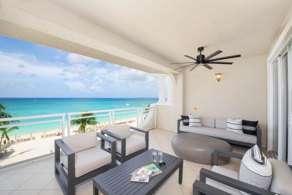 Furnished balcony with oceanfront views.