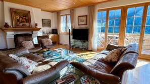 spacious living room with tv and beautiful views 