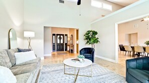 One big sofa, two armchairs, one coffee table, two end tables and one floor light.
