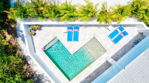 Pool and lounge area with patio furnishings -  perfect for enjoying time in the Florida sun with family and friends or a ROMANTIC MOONLIT EVENING watching the millions of stars in the sky.