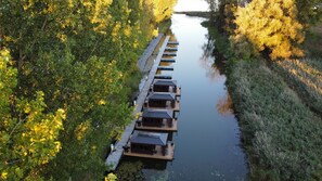 Aerial view of floating cabins in the canal 