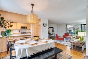 Six person dining table plus breakfast bar provide ample room for eating