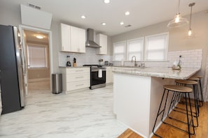 Gourmet kitchen complete with gas range, perfect for a family meal or romantic dinner.