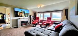 Relax in the 2nd floor living room with 75" TV, fireplace and OMG views!