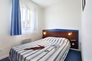 Get a good night's rest in the cozy bedroom.