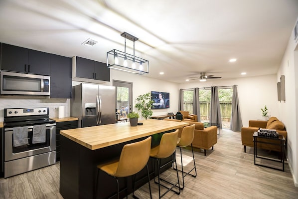 Enjoy the open concept kitchen and living areas with your group!