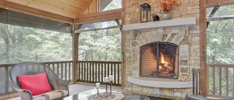 Covered screened in porch and wood burning fire place