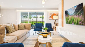 Spacious living room area with cozy sofa, perfect for family reunion