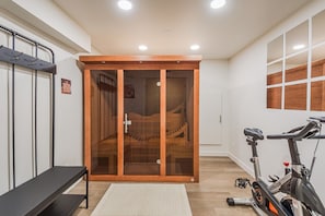 Our private room features a sauna and a spin bike for your fitness and relaxation needs.