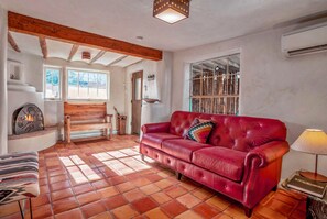 Living room with kiva fireplace