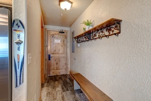 Entryway with convenient bench, hooks, and ski hangers