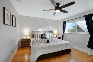 Our Master bedroom with King bed and large walk in closet. Sheets are high quality and mattresses are new, comfortable, and well protected with mattress encasement, and waterproof mattress protectors.