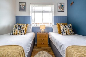 The twin bedroom with built in wardrobe and linen and towels provided 