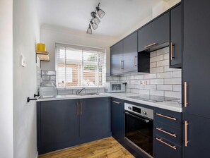 The kitchen includes fridge, microwave, dishwasher, kettle and welcome hamper!