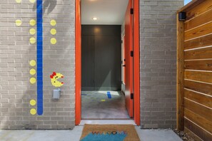 Side entrance to indoor/outdoor studio garage