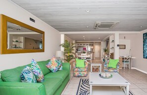 Living room with A/C, patio and smart tv