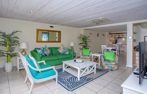 Living room with A/C, patio and smart tv