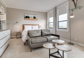 Queen size bed, clean linens, AC. Windows for natural sunlight. Lounge chair by the bed. Coffee Table