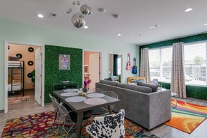 Step into this stunning living room, a sanctuary of comfort and style. With its abundance of natural light and elegant furniture, it's the perfect space to unwind and relax.