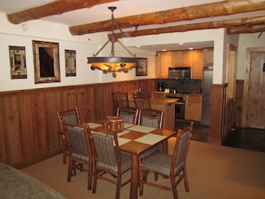 View of dining and kitchen in 3 bedroom unit.