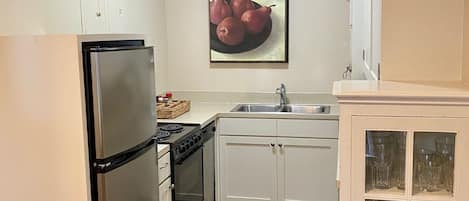 Full kitchen with gorgeous 1920's restored cabinets, double sink 
& dishwasher