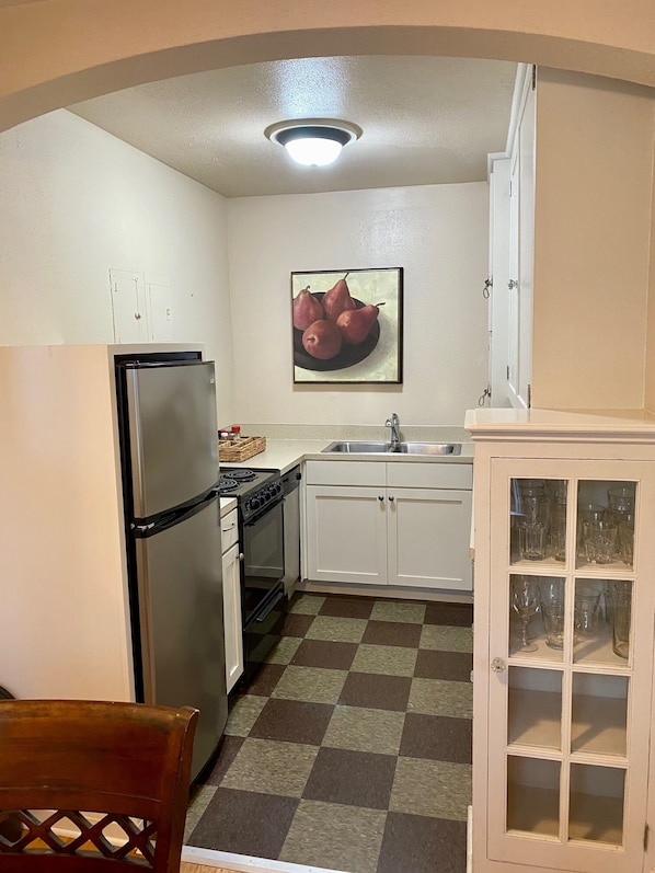 Full kitchen with gorgeous 1920's restored cabinets, double sink 
& dishwasher