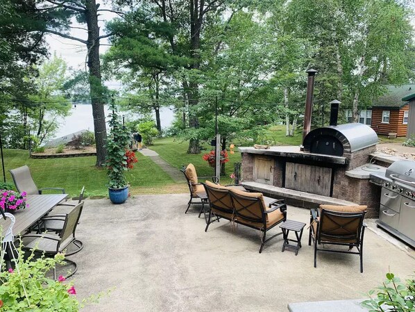 Patio area overlooking the lake and boathouse.