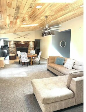 Spacious living room with game table