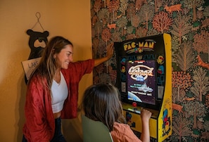 Enjoy Galaga or Pac Man and our two arcade stations!