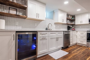 Kitchen- beverage fridge, extra large single bowl sink, and dishwasher 