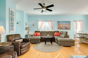 spacious and beautiful living area with coastal colors. 