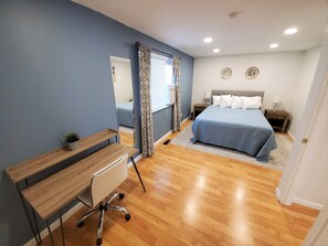 Main bedroom has AC and enough space for an extra bed, and a workstation.