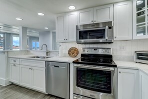 Sparkling Fully Equipped Kitchen with Quartz Countertops and Stainless Appliances