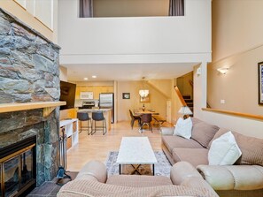 Living Room - Hardwood floors throughout, open concept leading to dining room, the perfect space for after ski/biking hanging out
