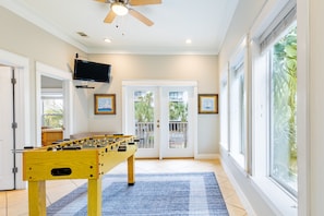 Tons of ways to play and stay entertained, including a game room with a foosball table, balcony, and TV.