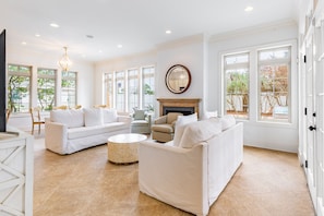 Living room features a fireplace and tons of natural light.