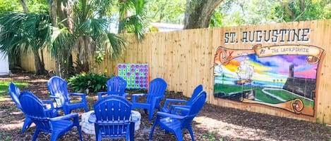 We have a large backyard with a giant mural of the fort, and a fire pit!