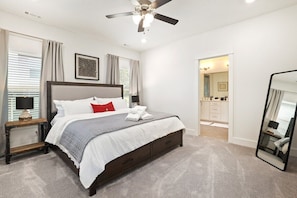 Our Primary bedroom is complete with a King-size bed, closet, 55-inch TCL Roku TV and stunning en suite bath.
