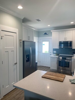 Kitchen showing front entrance 