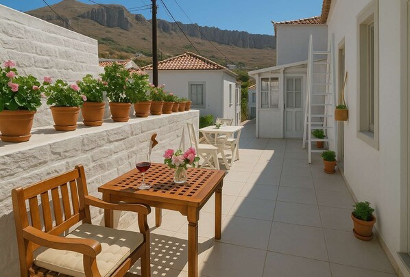 Sip coffee or dine al fresco amidst Hydra's island stunning backdrop