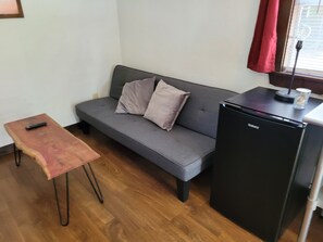 Soltow cabin futon couch and mini fridge