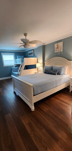1st floor frontside bedroom with queen, bunk, TV and access to full bath