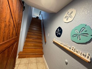 Entry - stairs to living area. Barn door into 1st floor bedrooms and bath