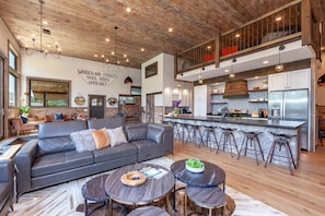 Stylishly designed open concept living room and kitchen for great conversations and relaxing