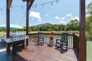 Breathtaking views at your outdoor Grill and patio seating. Mountain reflections on the water, yes please!