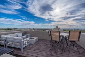 "Enchanting Rooftop Deck Panorama: Vibrant City Nights & Serene Mountain Peak Views – A Visual Treat for the Soul"