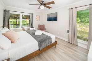 First master suite is located on the main level. It contains a king bed, Roku TV, and attached bathroom